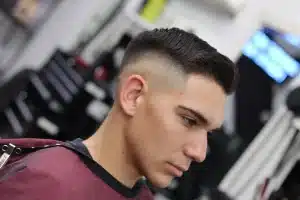 Low Taper Fade Comb Over Haircut for Clean Modern Style